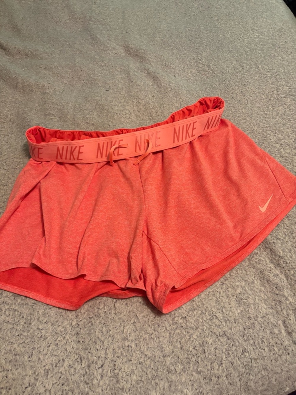 Nike women’s orange and peach athletic shorts